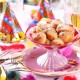 Carnival and party place setting with small berliners (fried doughnut)